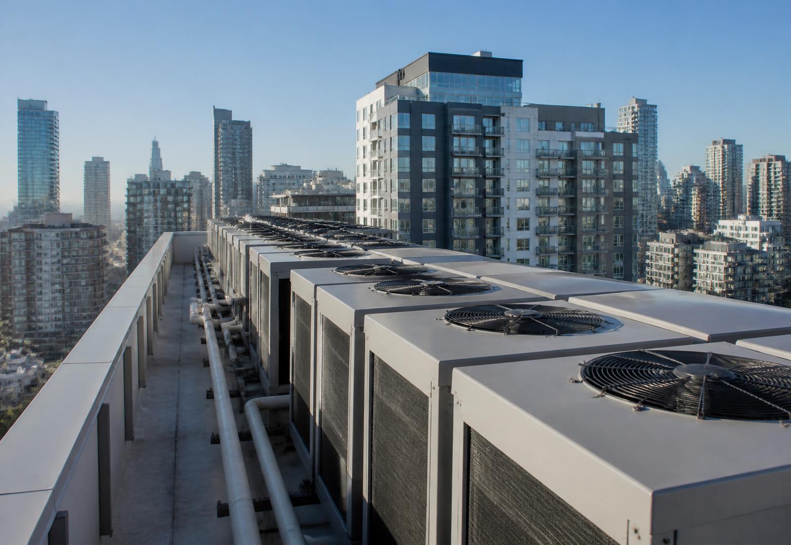 Commercial rooftop HVAC units on a high-rise building