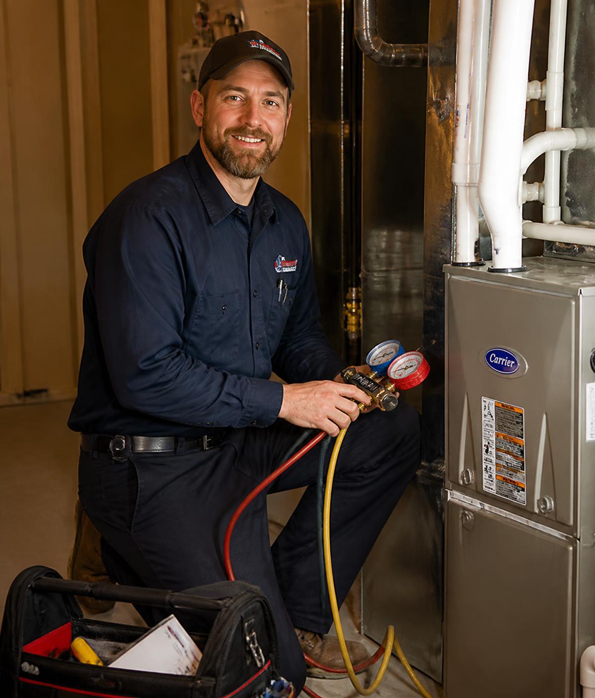 HVAC technician servicing a home furnace